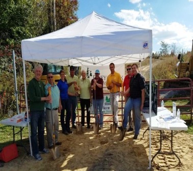 Members of the Piney Creek Watershed Association posing for a group photo outdoors under a canopy.