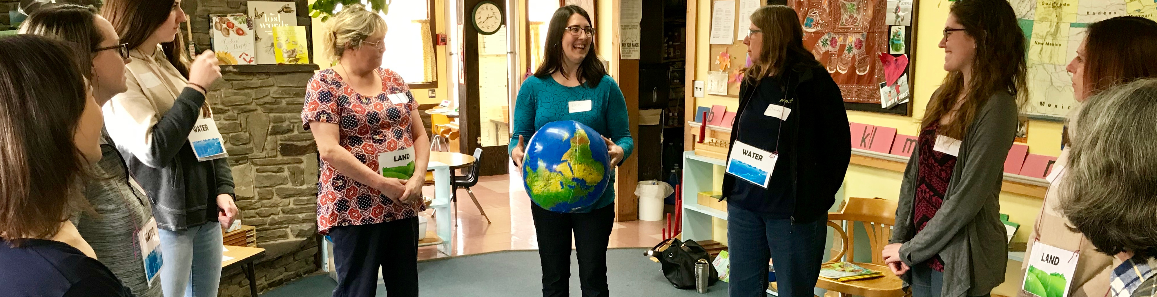 Banner image of attendees of the Early Childhood workshop: 'Getting Little Feet WET' learn the 'Blue Planet' activity