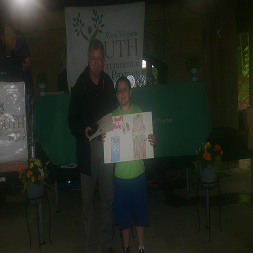 Ed Maguire presenting Vecellio Memorial Art Poster Award to winner Nathan Thomas. 