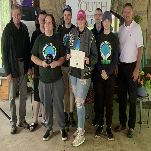 Ed Maguire and Erik Sims presenting the Rhododendron Environmental Award to winner Wyoming East High School Friends of the Earth Club. 