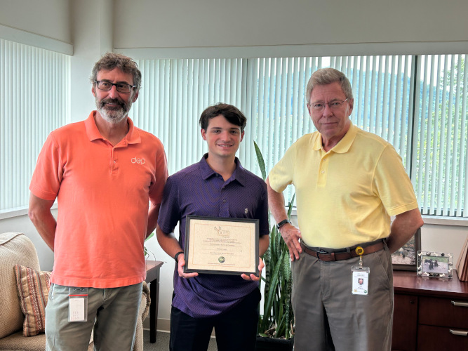 Carter Takarsh, of the Winfield Scotts 4-H Club, stands between Dennis Stottlemyer and Ed McGuire, of the WV Department of Environmental Program, while displaying his certificate.