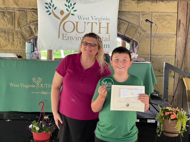 Annette Hoskins, director of the Youth Environmental Program, poses for a photo with Kameron Hart, of the Letart Pioneers 4-H Club of Mason County.